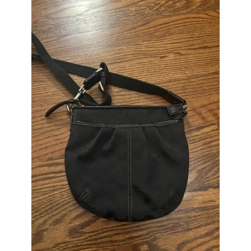 Coach crossbody handbag purse adjustable strap black jacquard logo spellout
